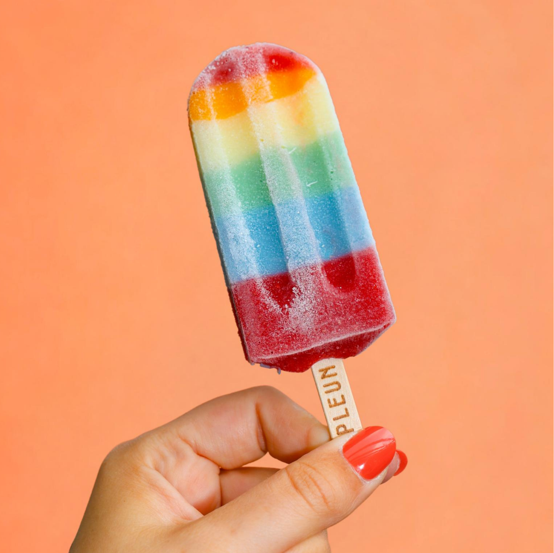 regenboogije in de hand